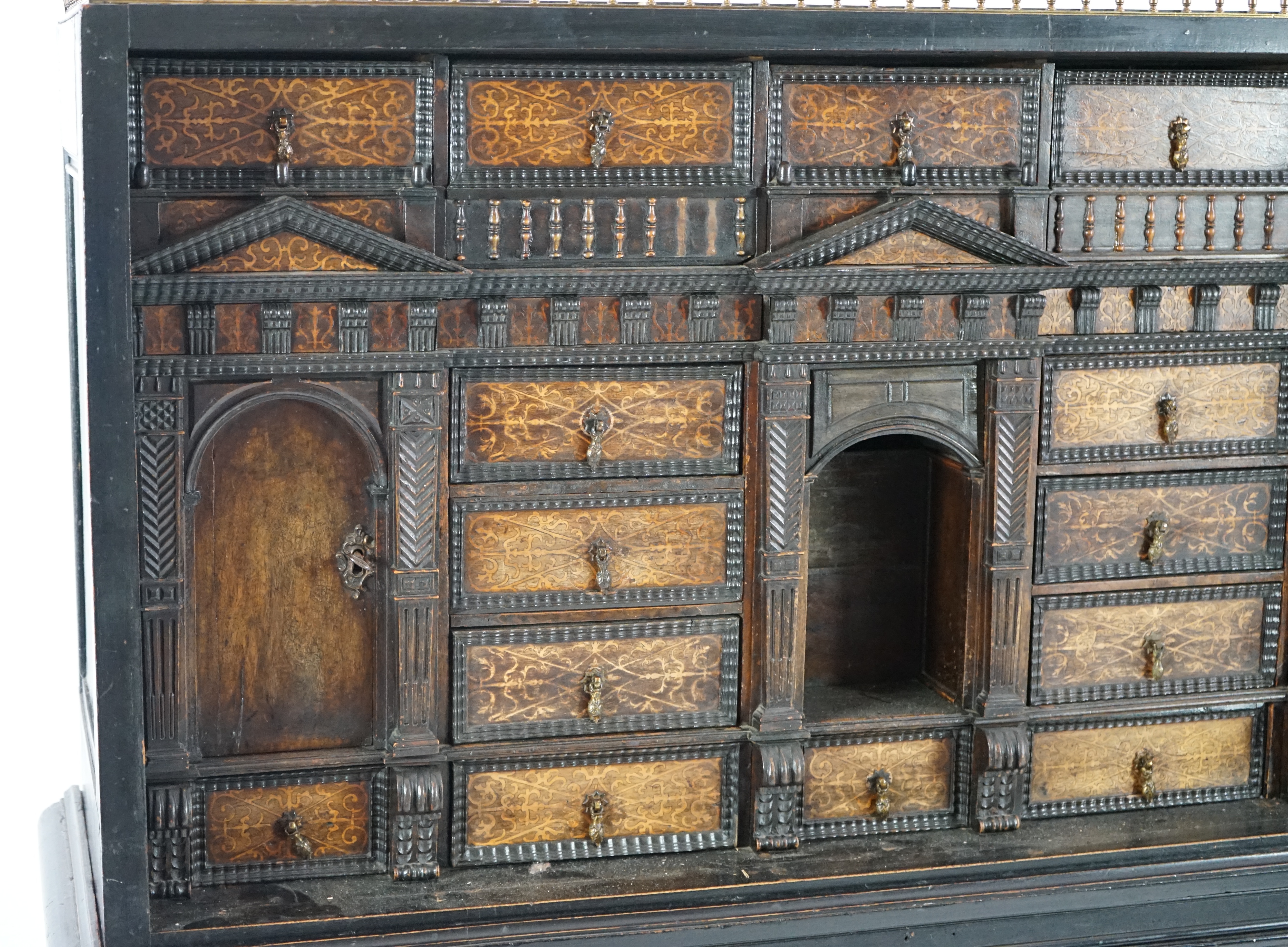 An 18th century and later Dutch walnut ebonised and marquetry inlaid collector's cabinet on stand